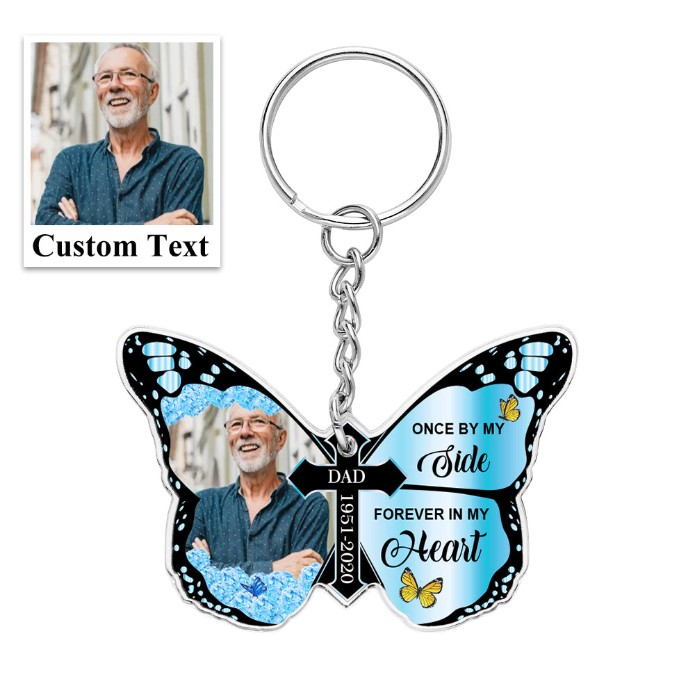 Selection of personalised butterfly and cross keychains displayed together as thoughtful memorial and anniversary gifts