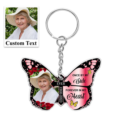 Acrylic butterfly and cross keychain held in hand for scale – 2.36in × 1.6in (6cm × 4cm) personalised remembrance keyring
