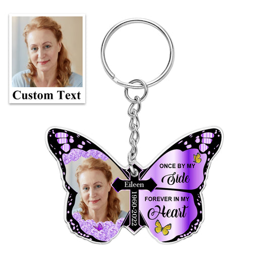 Personalised Butterfly & Cross Keychain on white background showing 'Once By My Side, Forever In My Heart' engraved-style text – acrylic memorial keyring 6cm × 4cm