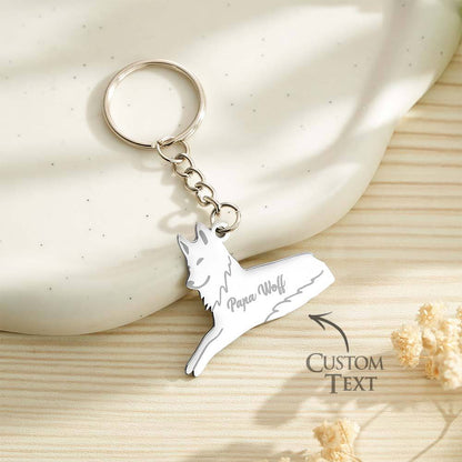 Personalised wolf family keyring shown on keys and a leather bag — custom name keychain and ideal gift for Mother's Day or birthdays
