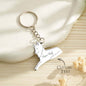 Personalised wolf family keyring shown on keys and a leather bag — custom name keychain and ideal gift for Mother's Day or birthdays