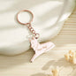 Monochrome edit emphasising engraved names on the wolf pendant — elegant personalised wolf keyring and engraved family keepsake