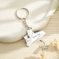 Studio flat lay of a personalised wolf keyring with engraved family names — engraved wolf family keyring made from tarnish‑resistant stainless steel
