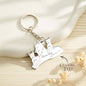 Macro of crisp personalised engraving on a wolf silhouette pendant — custom name keychain, high‑quality engraved family keepsake