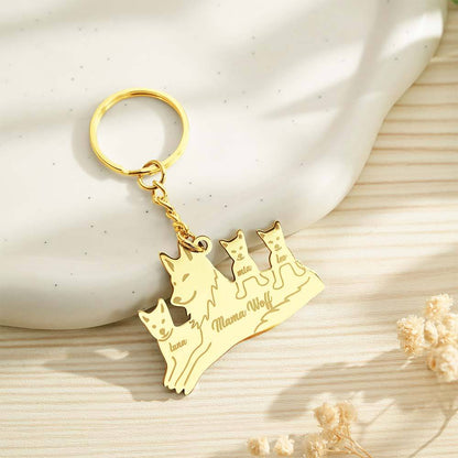 Wolf family keyring attached to a backpack zip as a charm — personalised engraved keyring for everyday use, thoughtful family gift