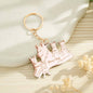 Personalised wolf family keyring pictured next to house keys and a smartphone — everyday engraved family keepsake and custom name keychain