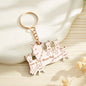 Assortment of personalised wolf family keyrings laid out to show individual name customisations — ideal personalised family gift for any occasion