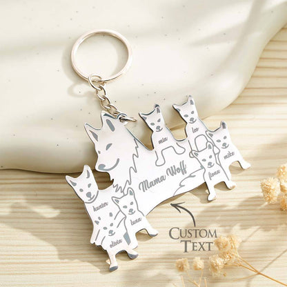 Lifestyle image of a personalised wolf keyring on a set of keys on a wooden surface — engraved wolf family keyring as a sentimental family gift