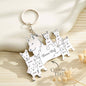 Lifestyle image of a personalised wolf keyring on a set of keys on a wooden surface — engraved wolf family keyring as a sentimental family gift