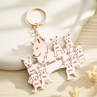 Keyring attached to a purse clasp in warm light showcasing engraving — personalised wolf family keyring gift idea for her or him