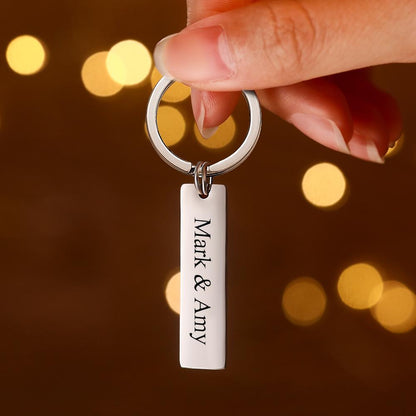 Close-up of engraved name and QR code on stainless steel personalised audio keychain — durable, long-lasting engraving