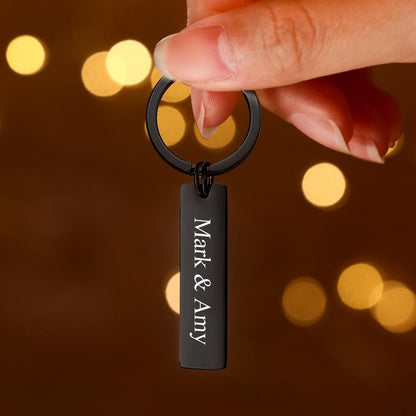 Close-up of round engraved QR code keychain on keys — hypoallergenic, nickel-free stainless steel custom audio keychain