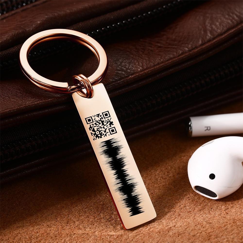 Heart-shaped personalised engraved QR code audio keychain in stainless steel — engraved name and scannable QR linking to a heartfelt voice message