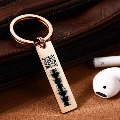 Heart-shaped personalised engraved QR code audio keychain in stainless steel — engraved name and scannable QR linking to a heartfelt voice message