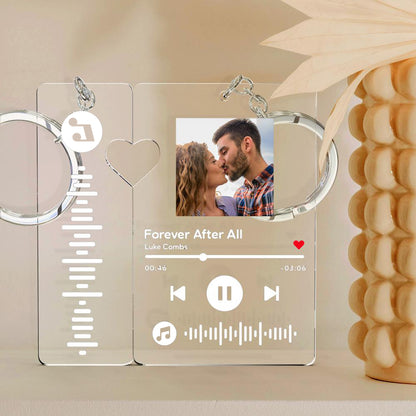 Personalised photo music keyring beside smartphone scanning the unique music code — custom scannable song keychain for couples
