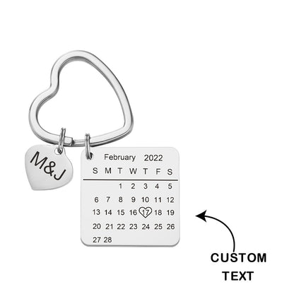 Detail of engraved initials and calendar date on personalised rose gold heart keyring — bespoke anniversary present