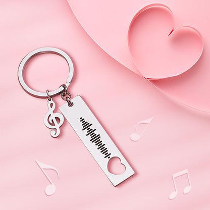 Close‑up of laser engraving on a 3D bar keyring showing the scannable music code and space for custom text — engraved music keyring and personalised Spotify code keyring