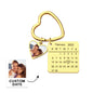 Personalised Photo Calendar Heart Keychain showing a heart pendant with engraved calendar and inserted photograph on a stylish keyring — save the date keyring gift for couples and anniversaries