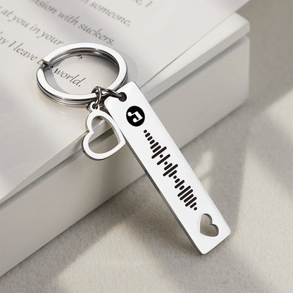 Detailed close-up of engraved text and scannable music code on a personalised heart keyring — perfect for Valentine’s, Mother’s Day or graduation gifts.