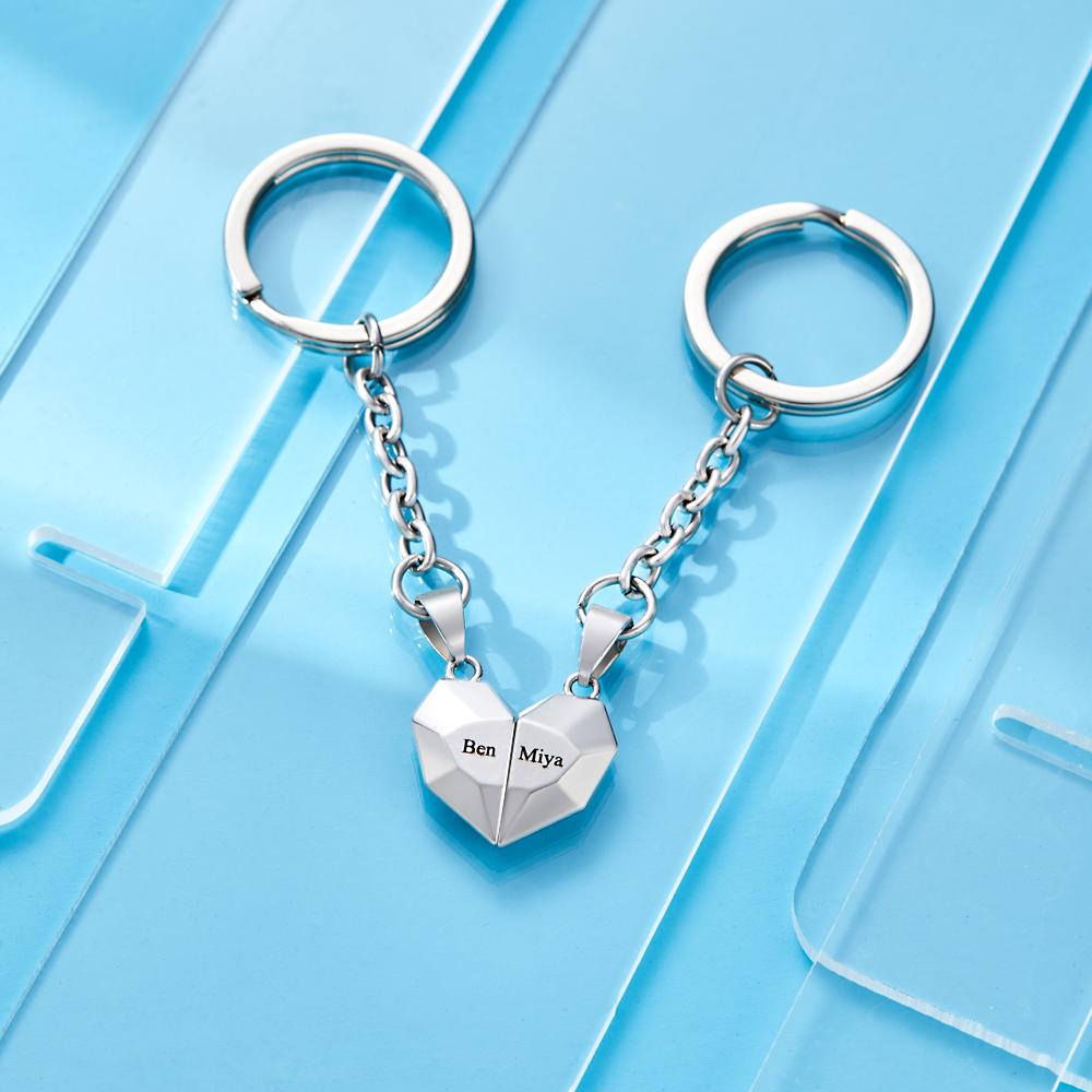 Front and reverse views of personalised engraved magnetic matching heart keychains showing customised names and date — engraved gift for him or her on anniversaries