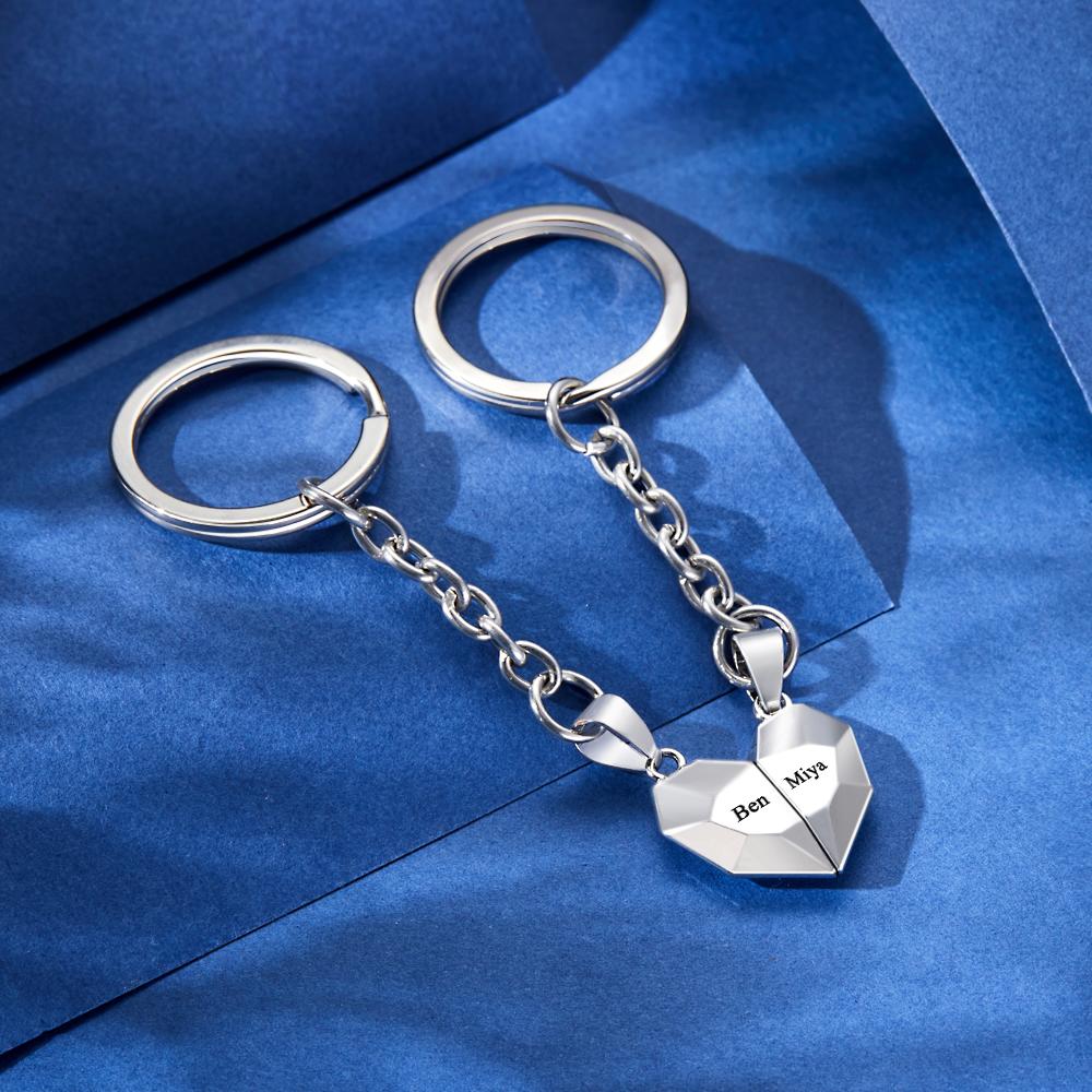 Lifestyle image of personalised engraved magnetic matching heart keychains attached to keys and a bag — practical yet sentimental anniversary gift for couples
