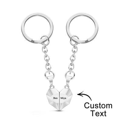 Personalised engraved magnetic matching heart keychains joined together — ornate jewellery-style keyrings as an anniversary gift for couples with custom names or date