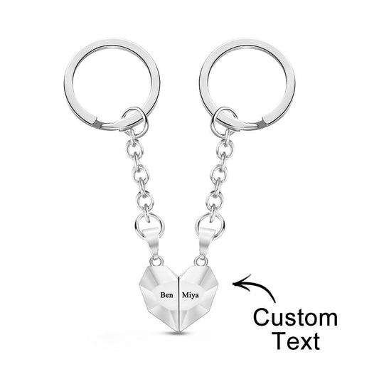 Personalised engraved magnetic matching heart keychains joined together — ornate jewellery-style keyrings as an anniversary gift for couples with custom names or date
