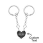 Pair of personalised engraved magnetic matching heart keychains shown separated to display matching halves — ideal personalised anniversary or Valentine's gift for couples