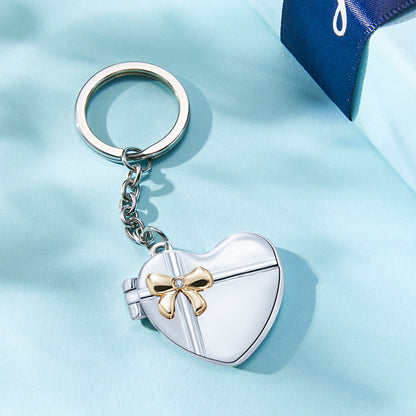 Close-up of personalised double-heart keyring showing intricate hand-finished ornate edge and space for custom text — commemorative gift for wife, husband or grandparents