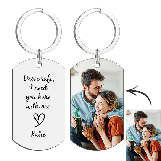 Close-up of engraved text and date on a personalised engraved tag keyring, showing high-quality precision engraving