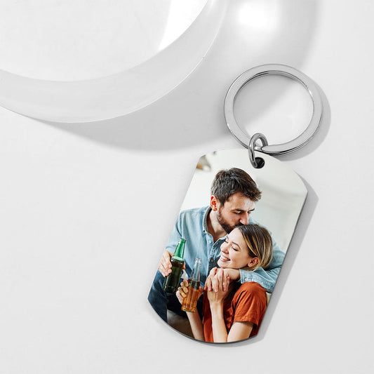 Close-up of engraved text and date on a personalised engraved tag keyring, showing high-quality precision engraving