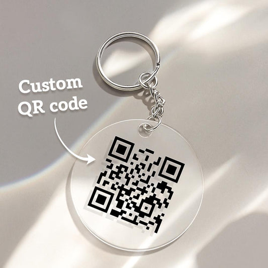 Close up of personalised scannable QR code on acrylic keychain highlighting crisp engraving and how the QR links to video audio or custom text