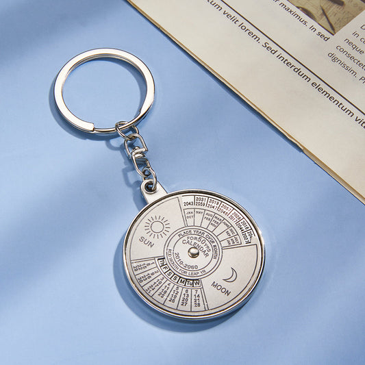 Personalised engraved stainless steel perpetual calendar keychain pendant, close-up of decorative calendar dial and polished finish – ideal personalised keychain gift for him