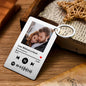 Personalised Spotify Code Keychain with engraved photo and song details on stainless steel plaque, close-up of scannable code