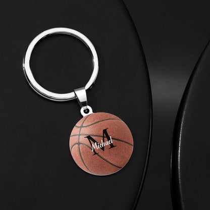 Close-up of personalised basketball keyring showing custom engraved name on stainless steel surface – ideal sports gift for players and coaches