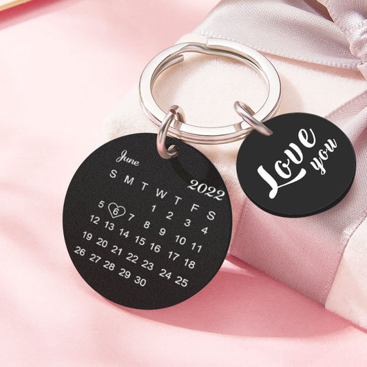 Close‑up of engraved dog tag keychain on a set of keys displaying a personalised date and short text — meaningful personalised anniversary keyring and gift for husband