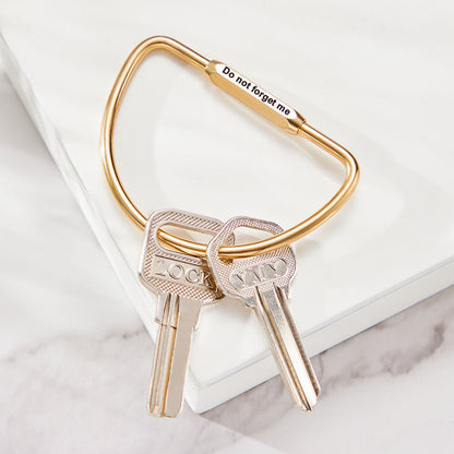 Custom engraved copper D carabiner clipped to a belt loop – personalised men's camping keyring, sturdy screw‑in lock