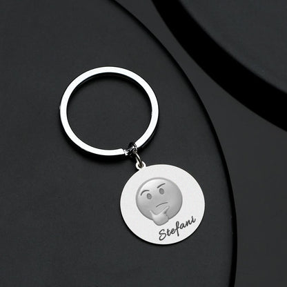 Array of personalised emoji keychains in stainless steel displaying multiple emoji designs and custom text options — ideal personalised gifts and quirky keyrings