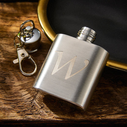Compact personalised stainless steel rectangle hip flask keyring clipped to keys, showing custom engraving and sleek polished finish — travel‑friendly keepsake gift