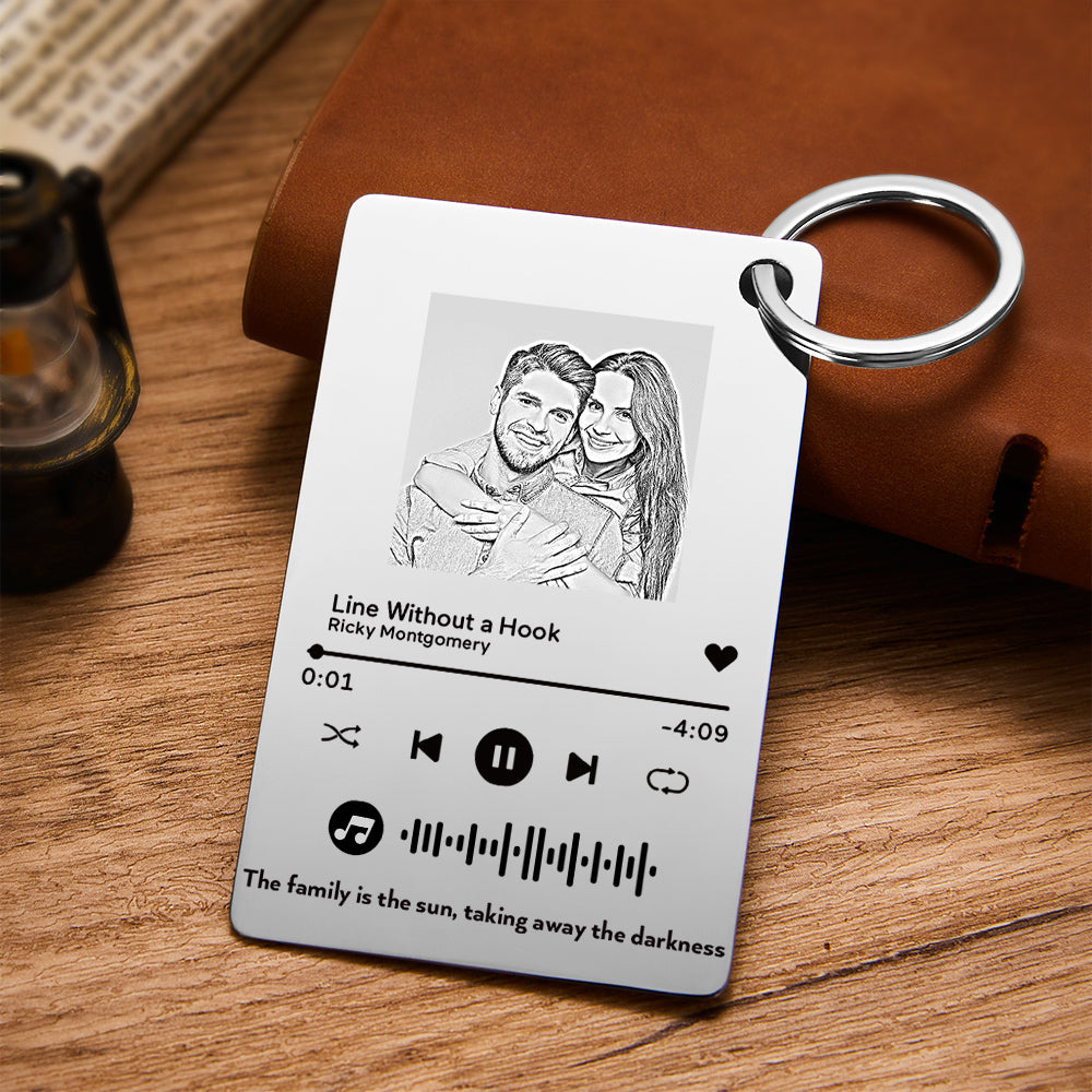 Hand-held personalised music plaque keychain displaying scale, keyring attachment and engraved photo with unique scannable music code — perfect romantic keepsake