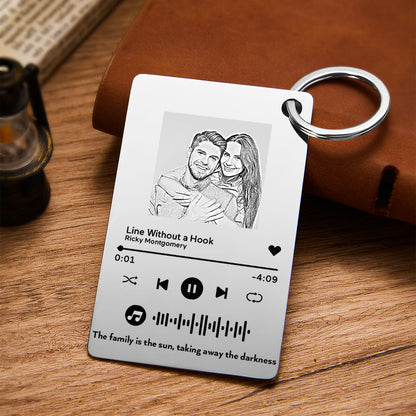 Hand-held personalised music plaque keychain displaying scale, keyring attachment and engraved photo with unique scannable music code — perfect romantic keepsake