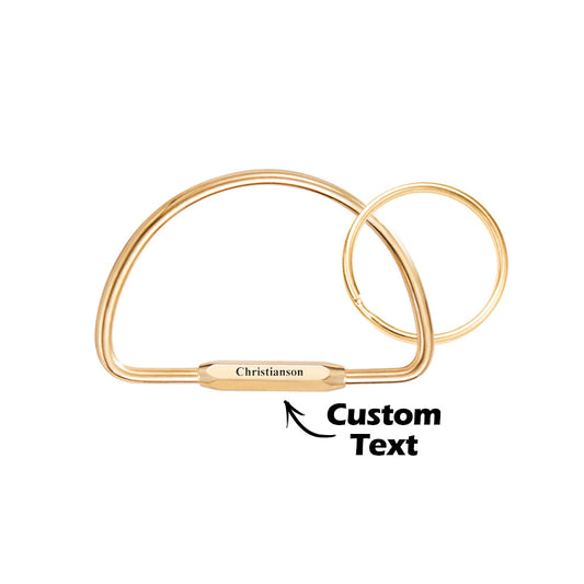 Personalised multi-layer brass-style keyring with custom engraved name on a layered charm and stainless steel ring — stylish personalised keychain gift.