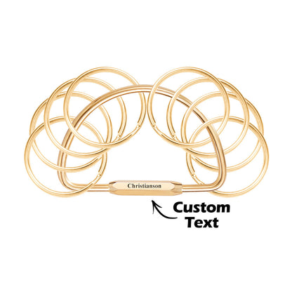 Examples of custom text and font options on a multi-layer brass keyring — choose names, dates or short quotes for your bespoke engraved keychain.