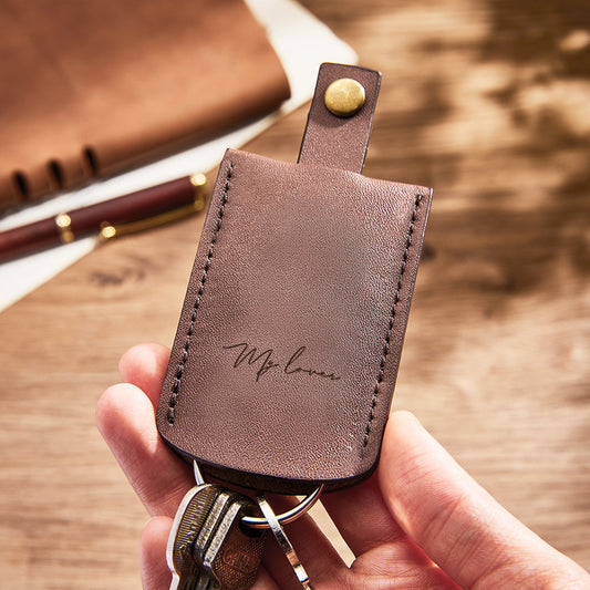 Lifestyle presentation of personalised engraved leather keychain as a keepsake gift — stylish personalised gift for him or her on anniversaries and special occasions