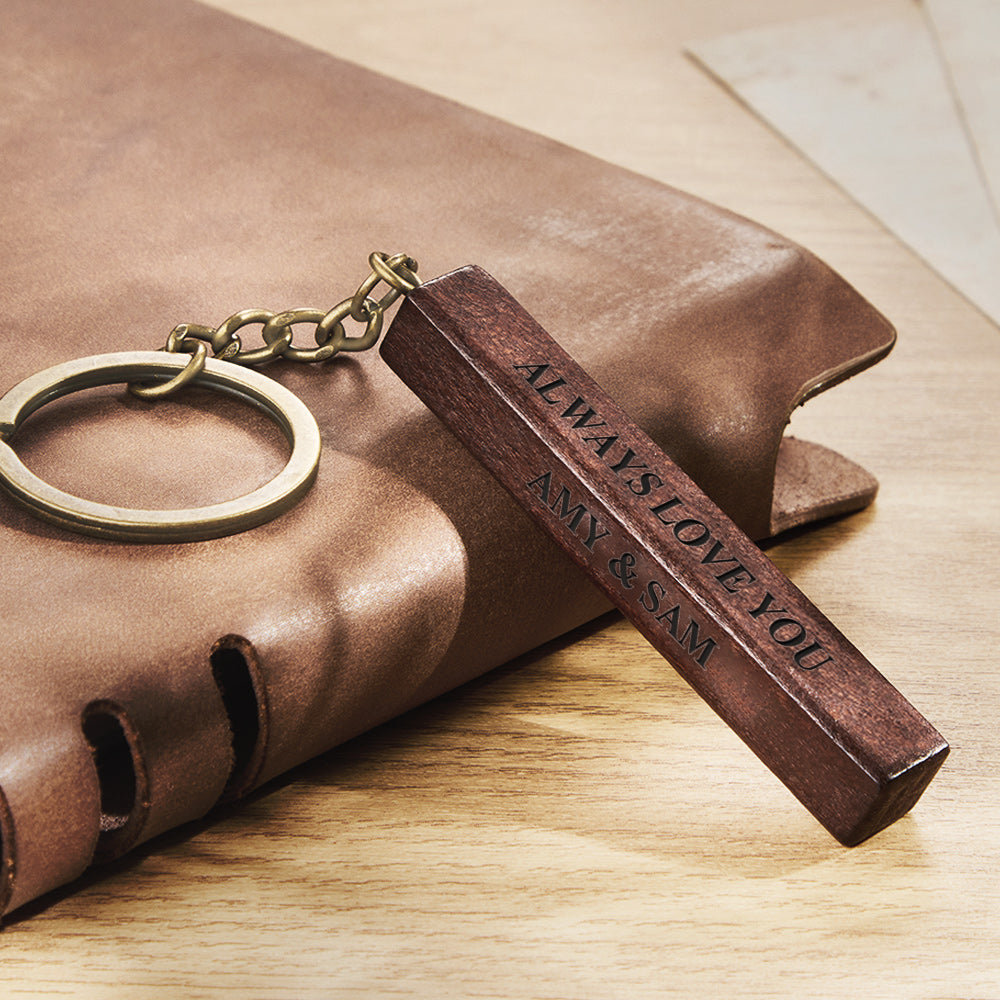 Personalised wooden keyring beside keys showing scale — 3-sided engraved custom photo keepsake ideal as an anniversary gift