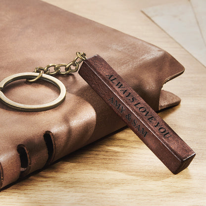 Personalised wooden keyring beside keys showing scale — 3-sided engraved custom photo keepsake ideal as an anniversary gift