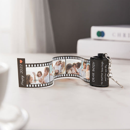 Personalised colourful film roll keyring attached to a handbag, colourful mini film motif with uploaded photo and custom name – everyday personalised keyring