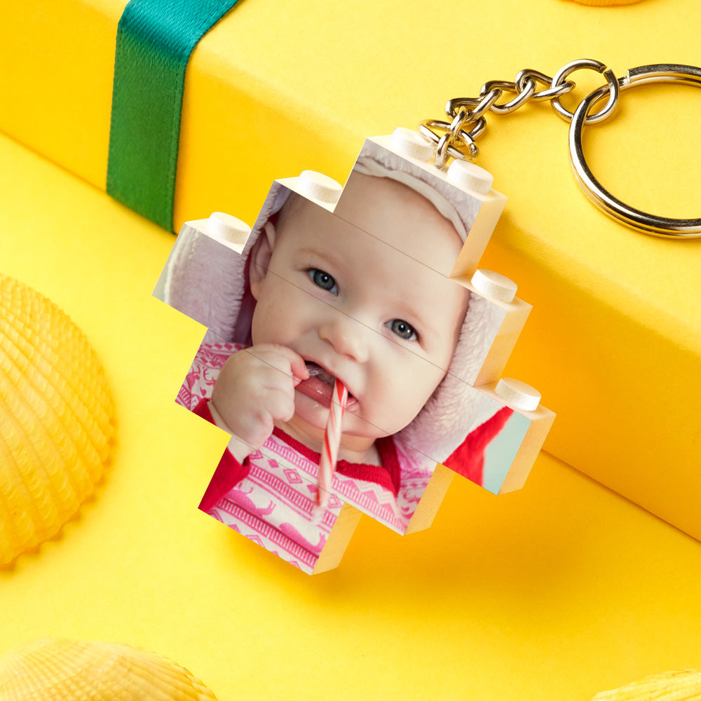 Close-up of personalised photo building-brick keychain (diamond shape) featuring baby photo – vibrant UV print, wipeable finish