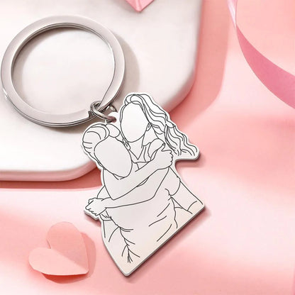 Close-up of hand-drawn 3D line art engraving on stainless steel personalised keychain with keyring attachment
