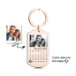 Angled view of a personalised black photo calendar keyring highlighting the durable black finish and neat engraved-style calendar — great personalised gift for men.